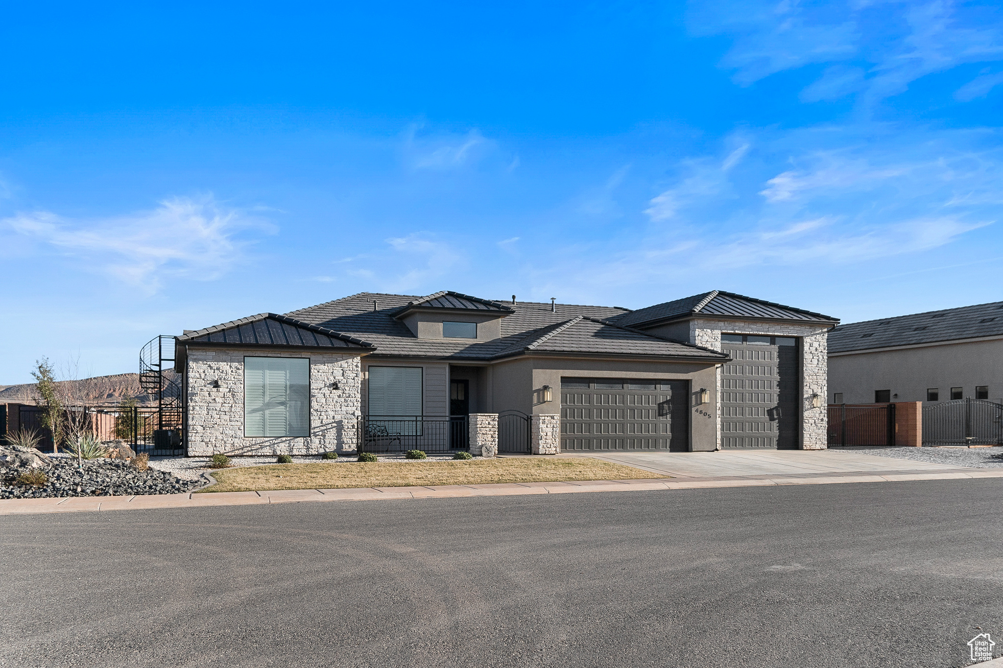 View of front of property featuring RV Garage and side yard storage.