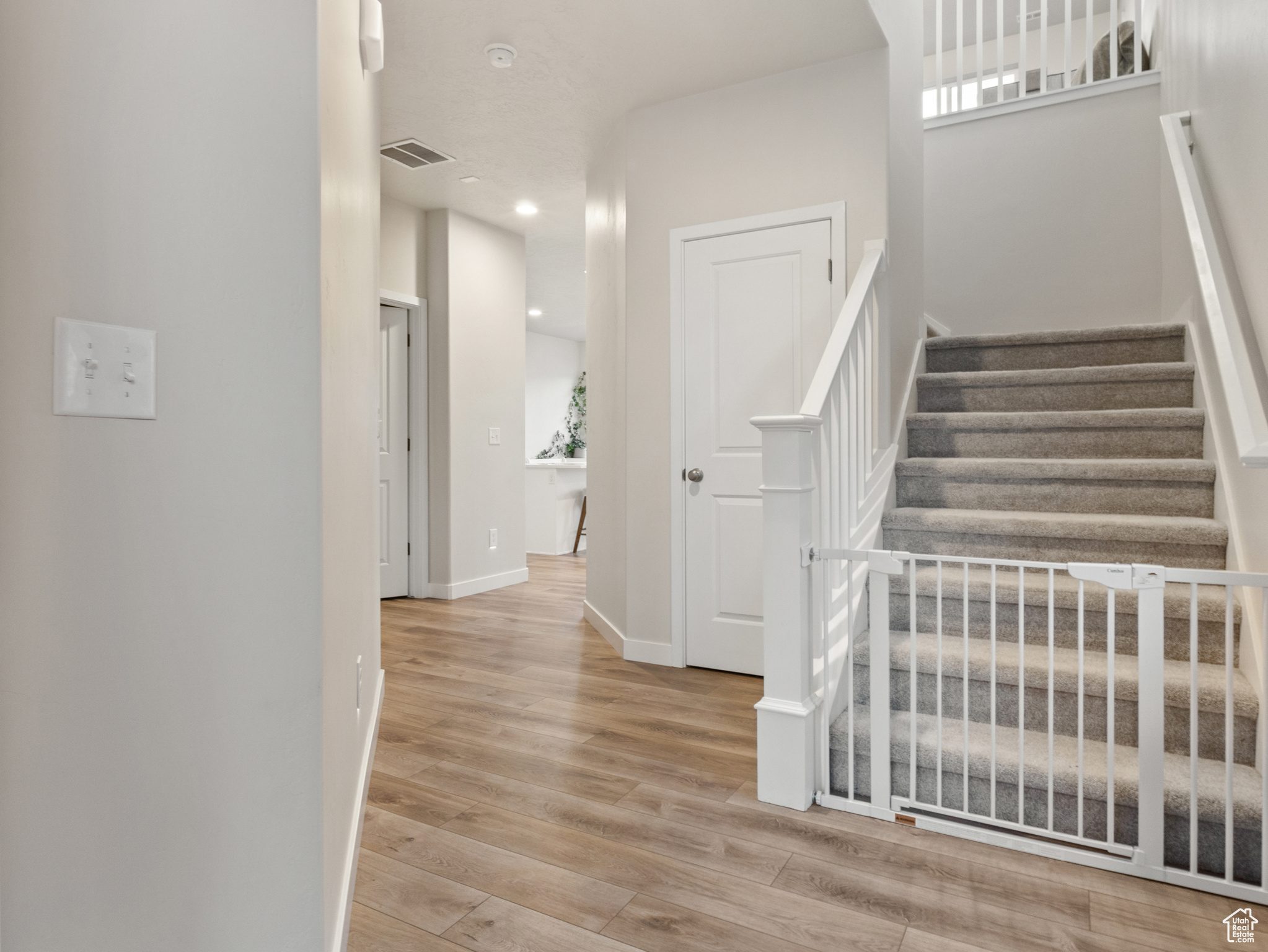 Staircase featuring wood-type flooring