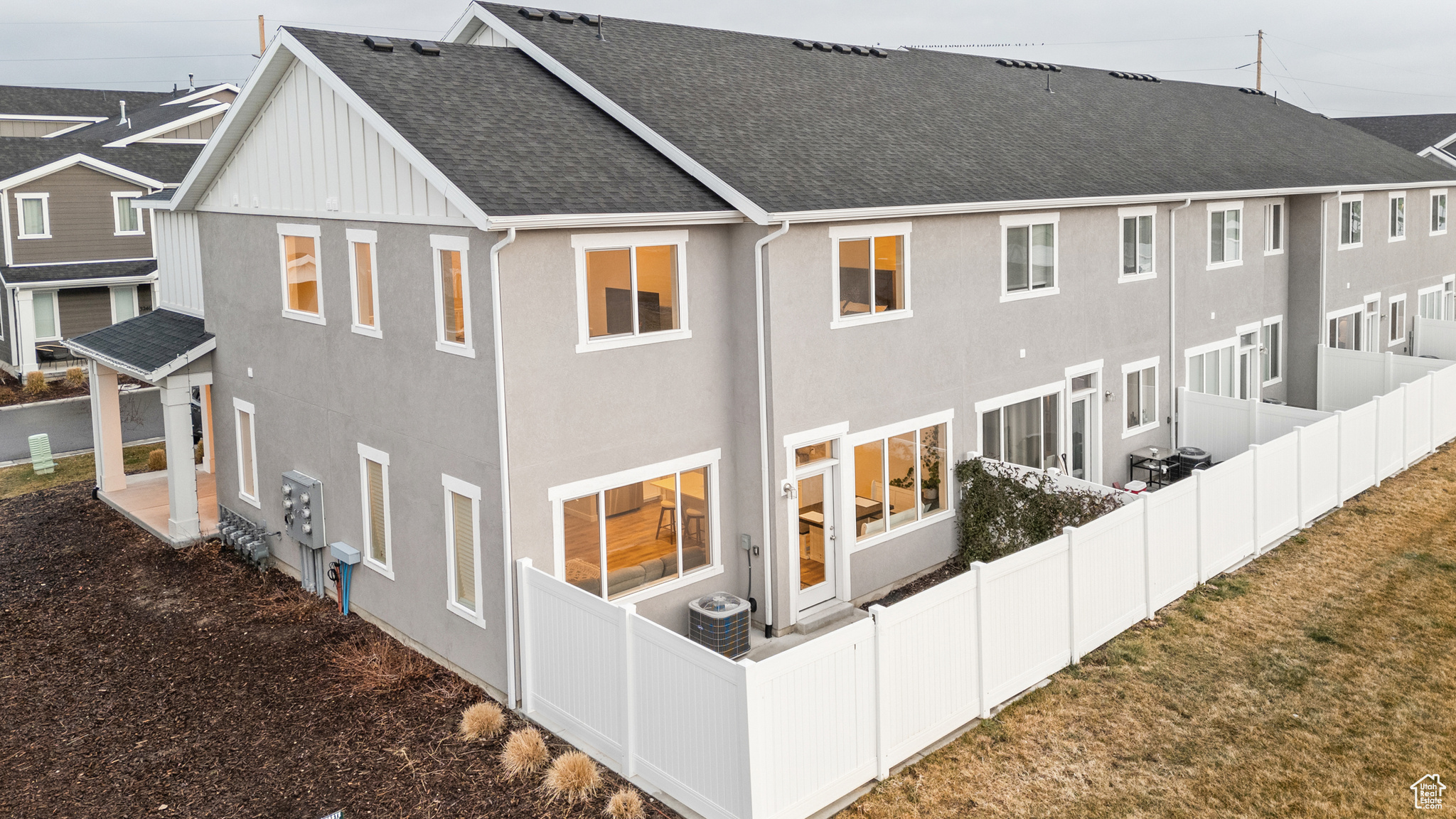 Back of house featuring central air condition unit