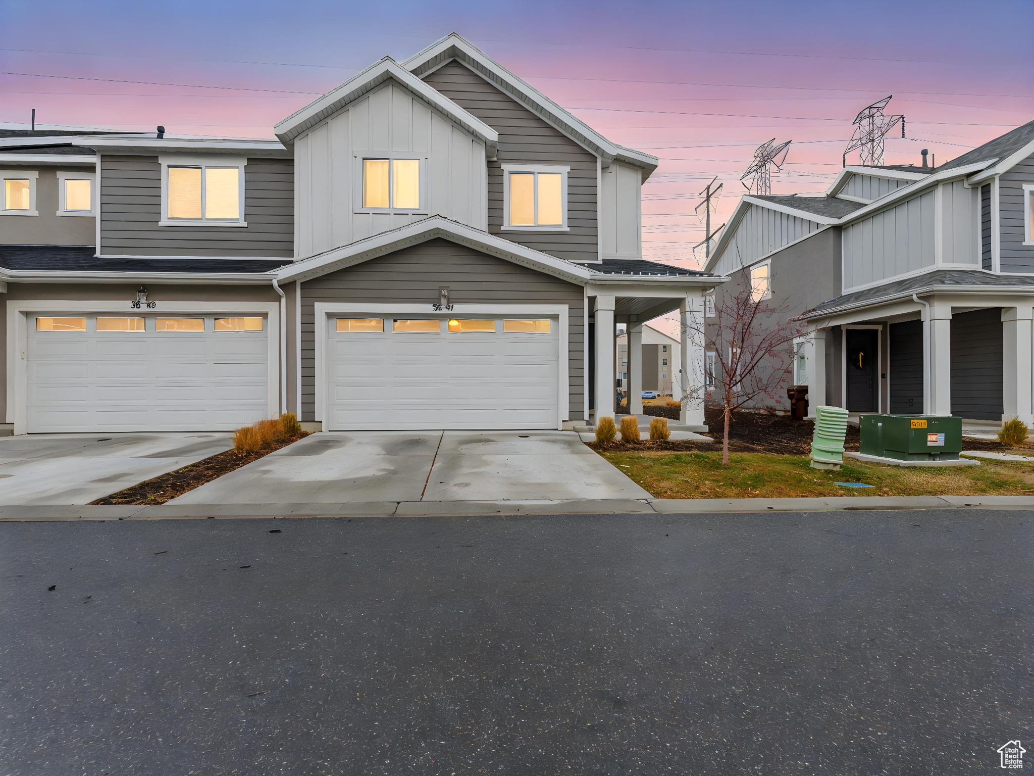 View of front facade featuring a garage