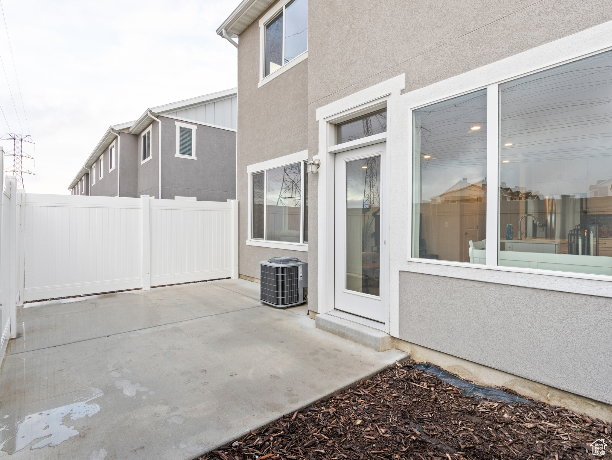 View of patio featuring central AC unit