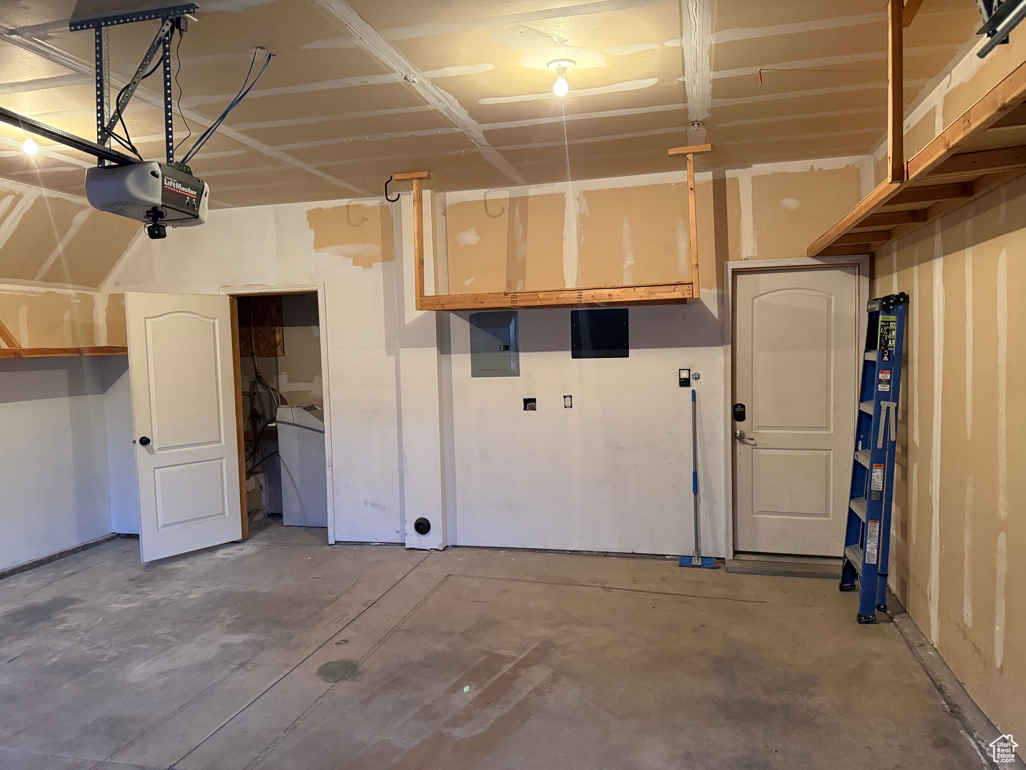 Garage featuring a garage door opener