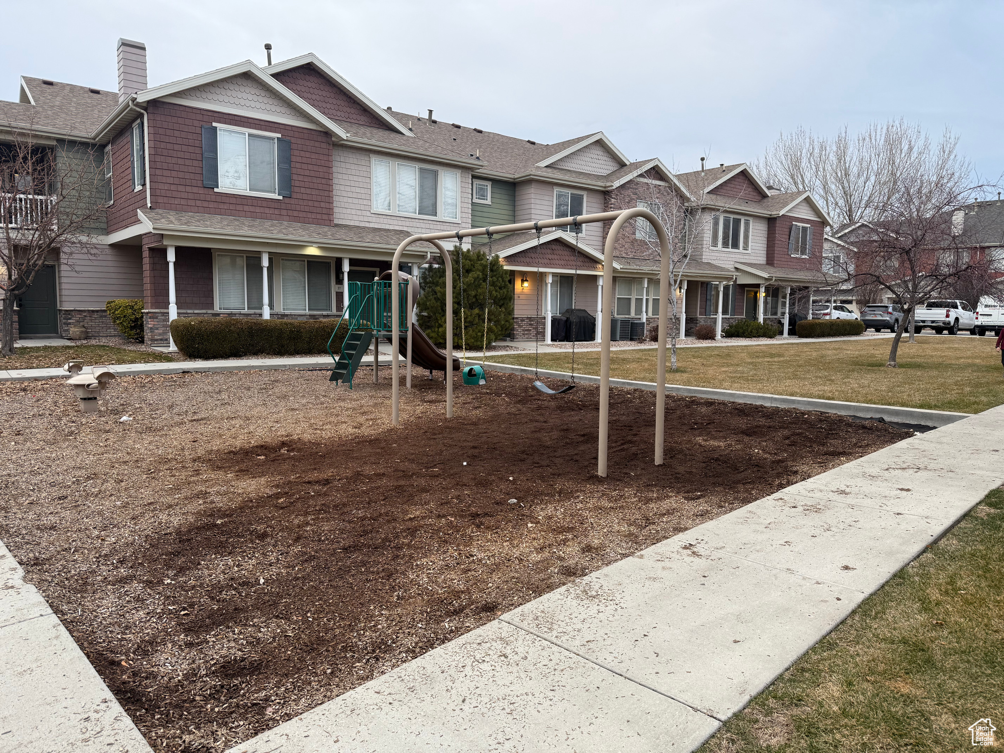 View of jungle gym with a lawn