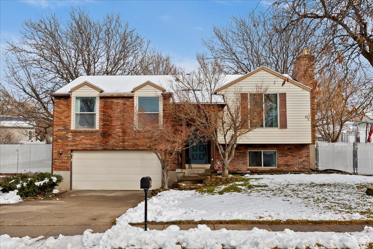 View of front of home featuring a garage