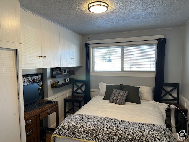 Bedroom featuring a textured ceiling