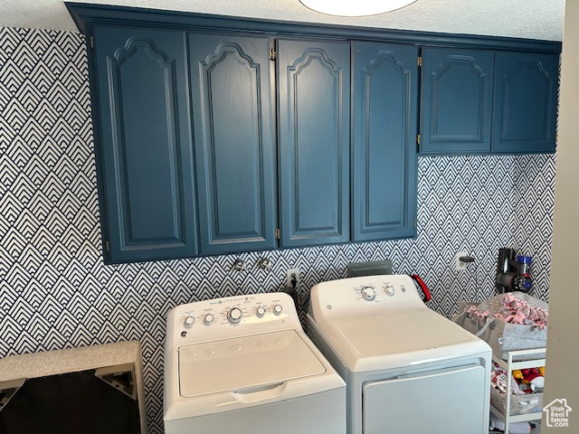 Laundry room featuring washing machine and dryer