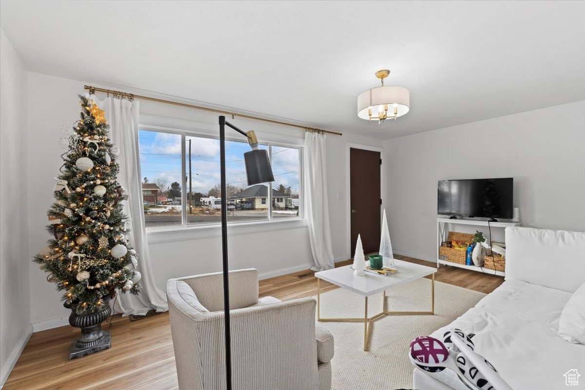 Living room with light wood-type flooring