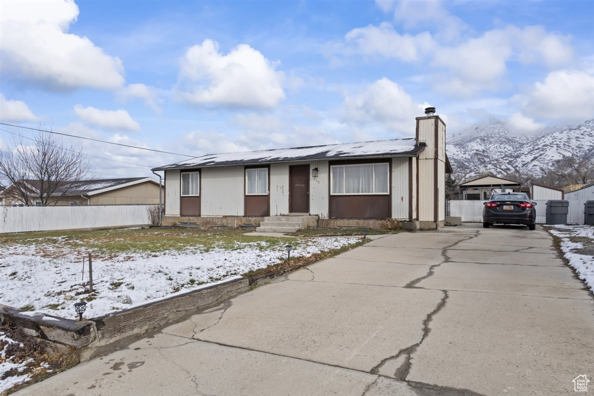 View of front of property with a mountain view