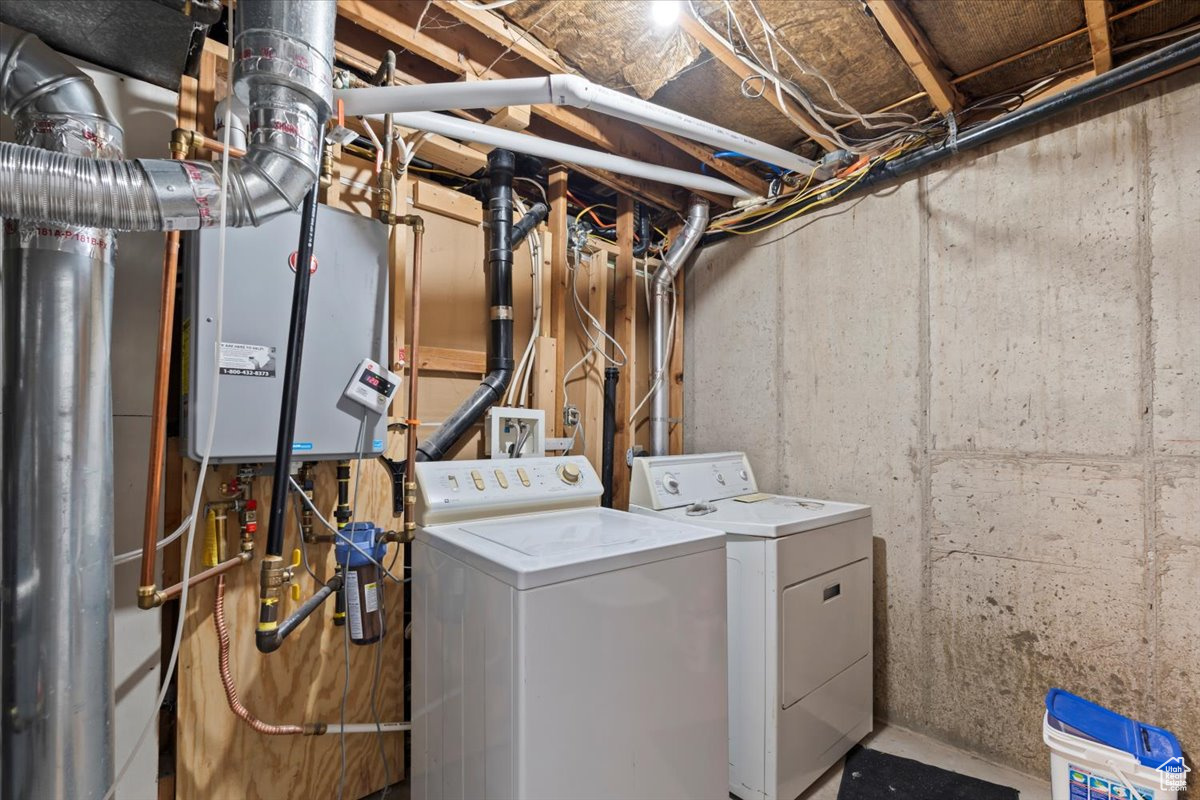 Clothes washing area featuring independent washer and dryer