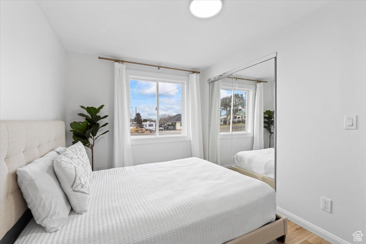 Bedroom featuring wood-type flooring