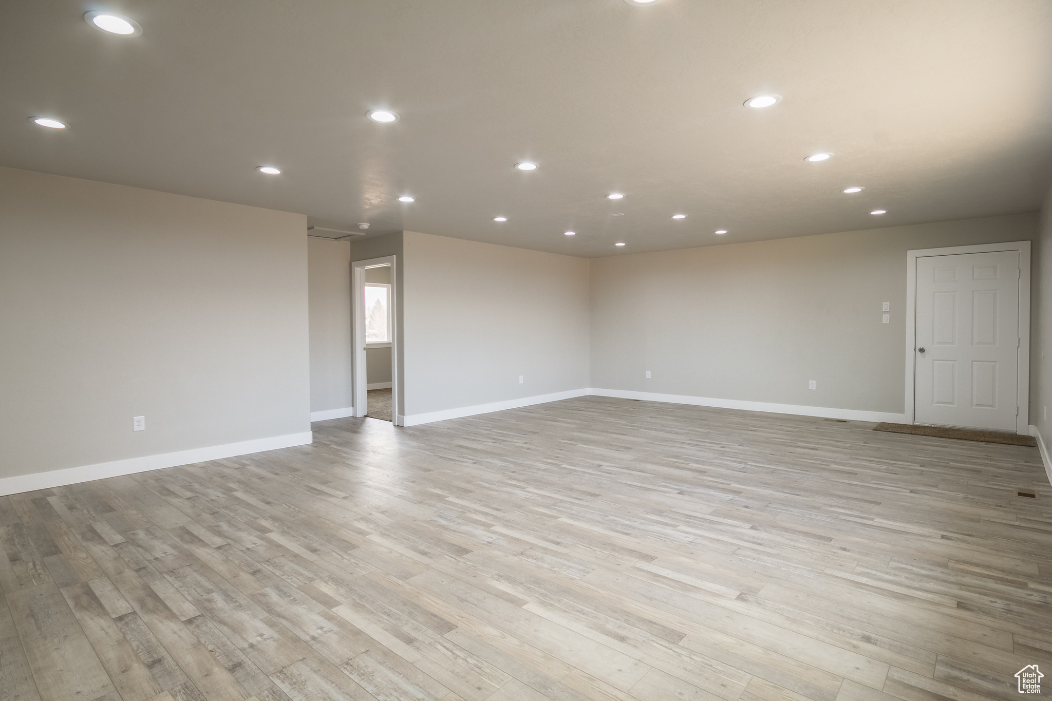 Unfurnished room featuring light wood-type flooring