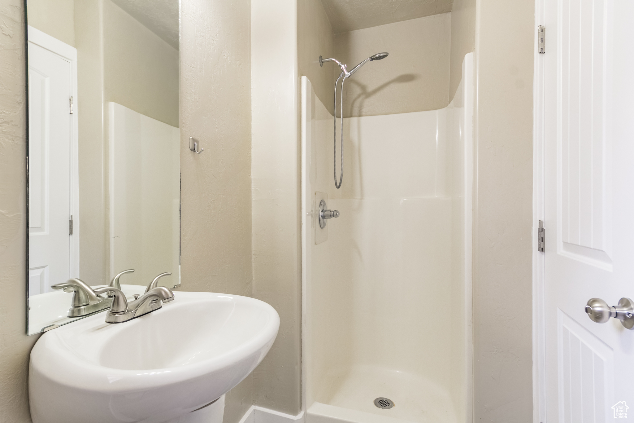 Bathroom featuring a shower and sink