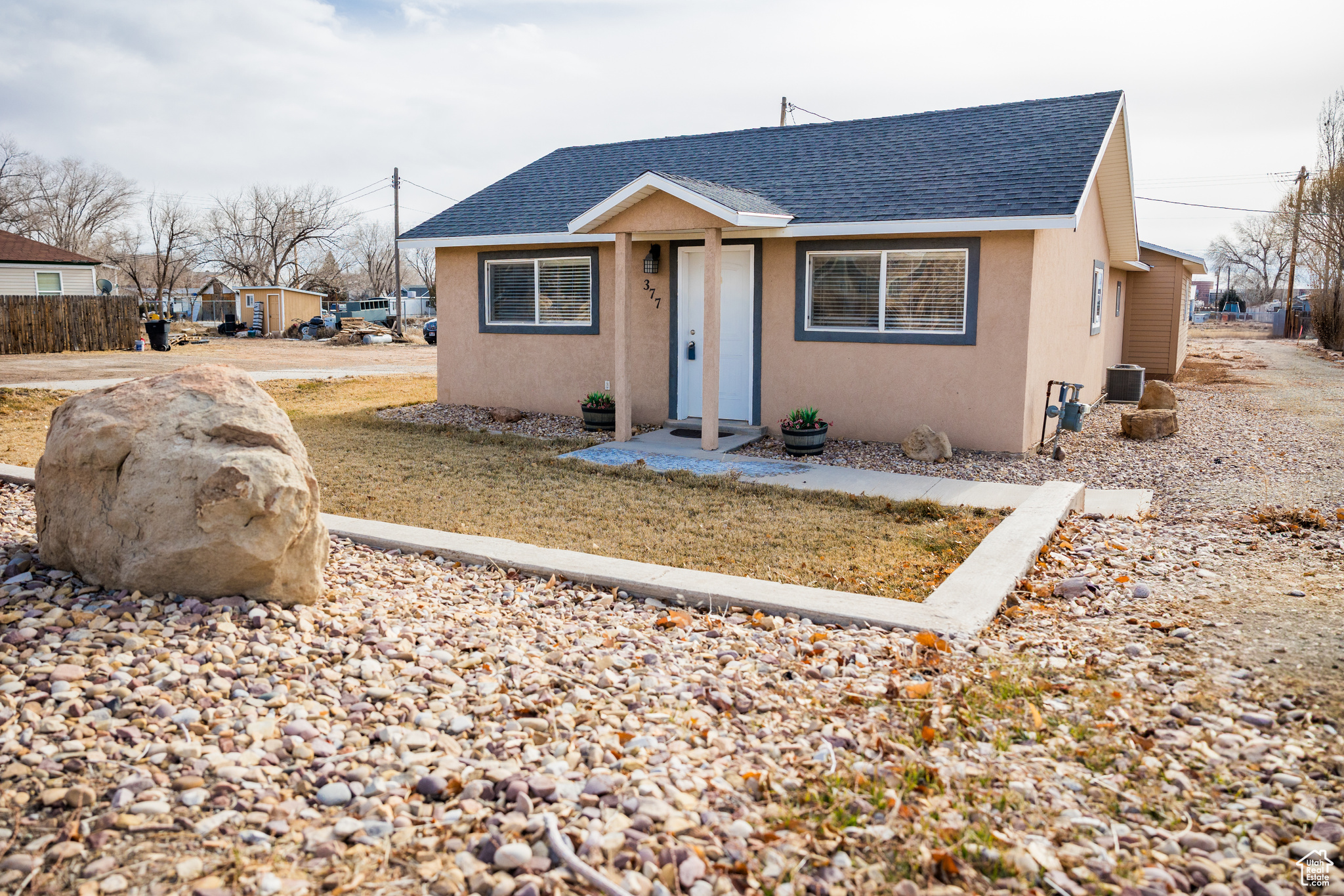 Bungalow-style house featuring cooling unit