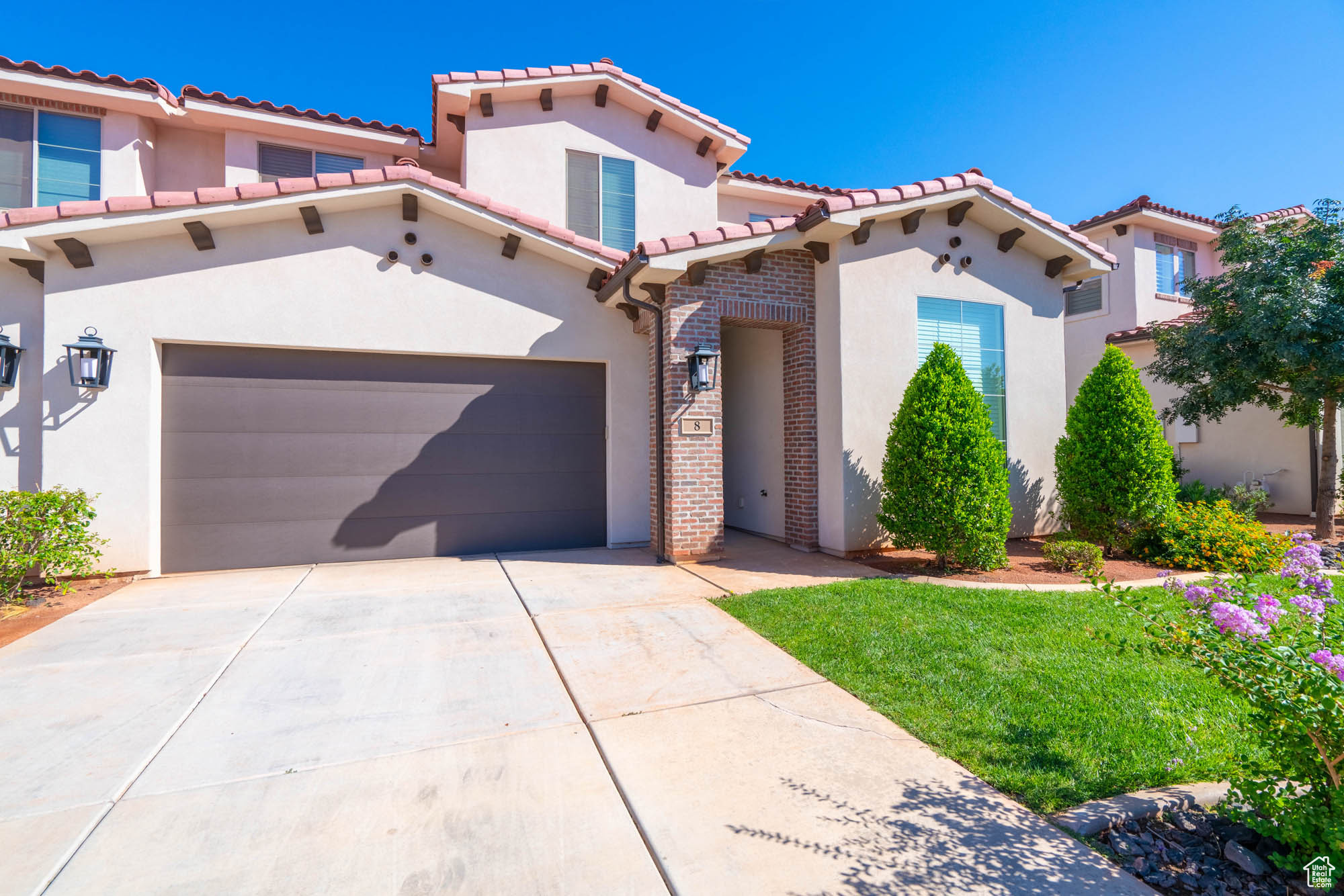 Mediterranean / spanish-style home featuring a garage