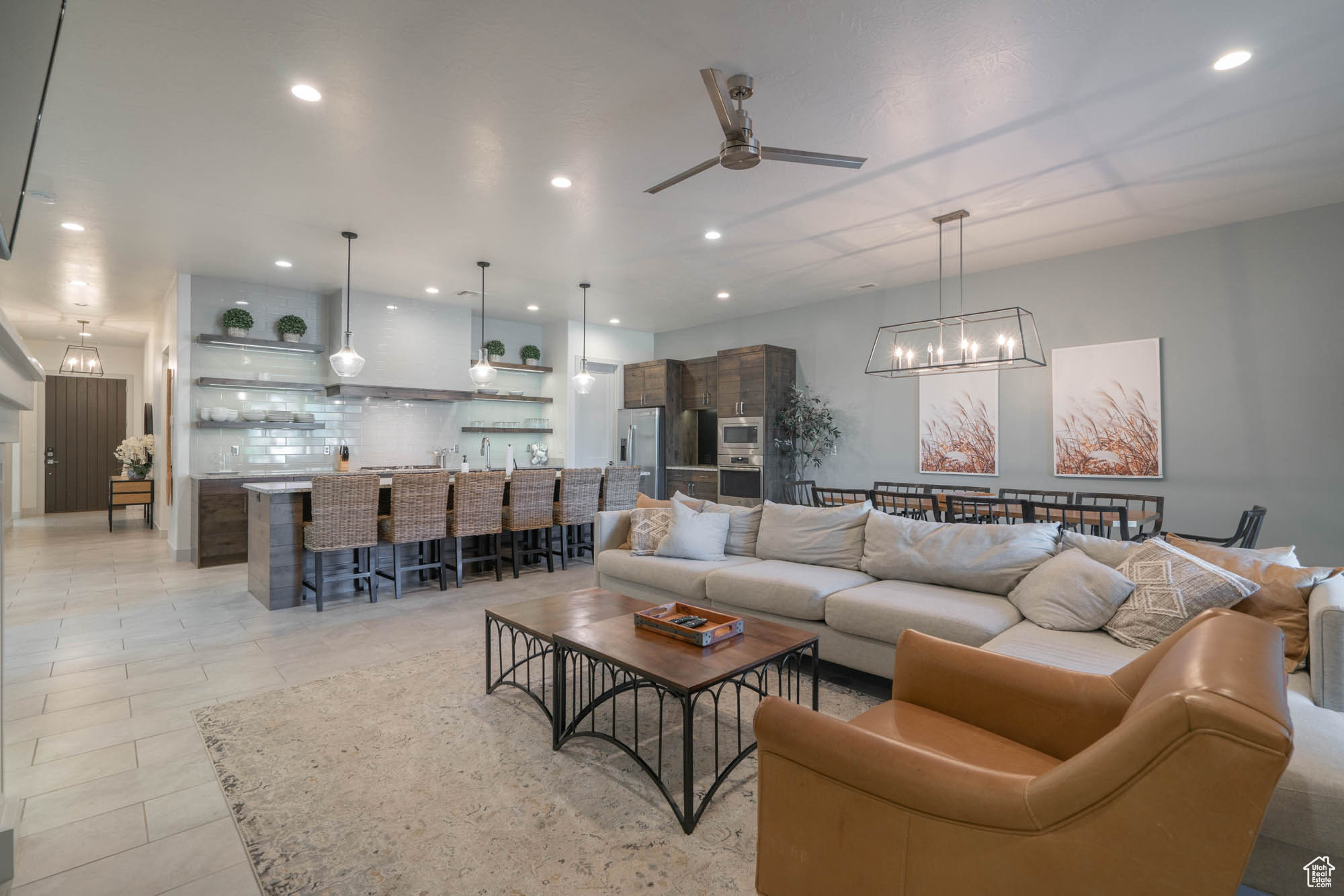 Tiled living room featuring ceiling fan