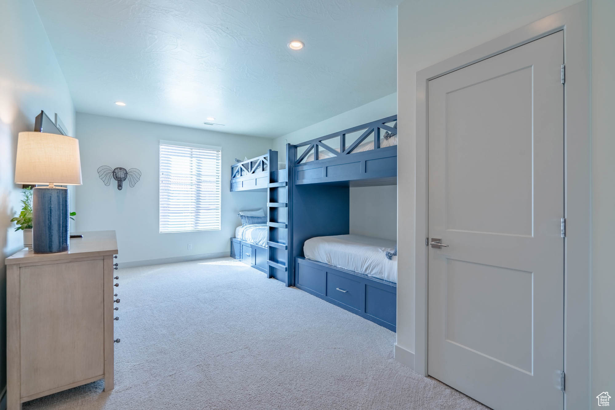 Bedroom with light colored carpet