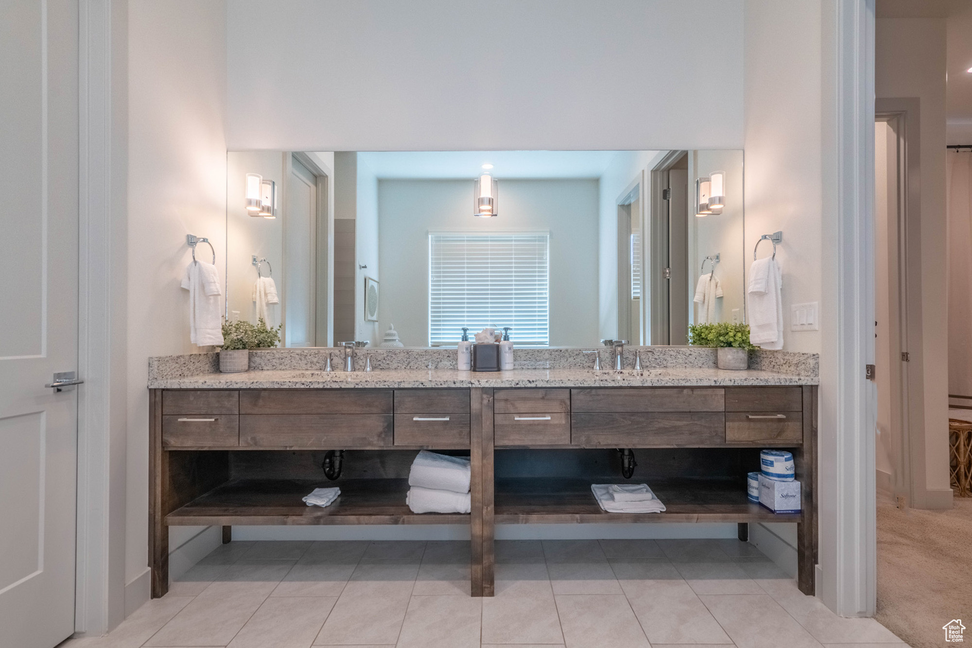 Bathroom with tile patterned floors and vanity