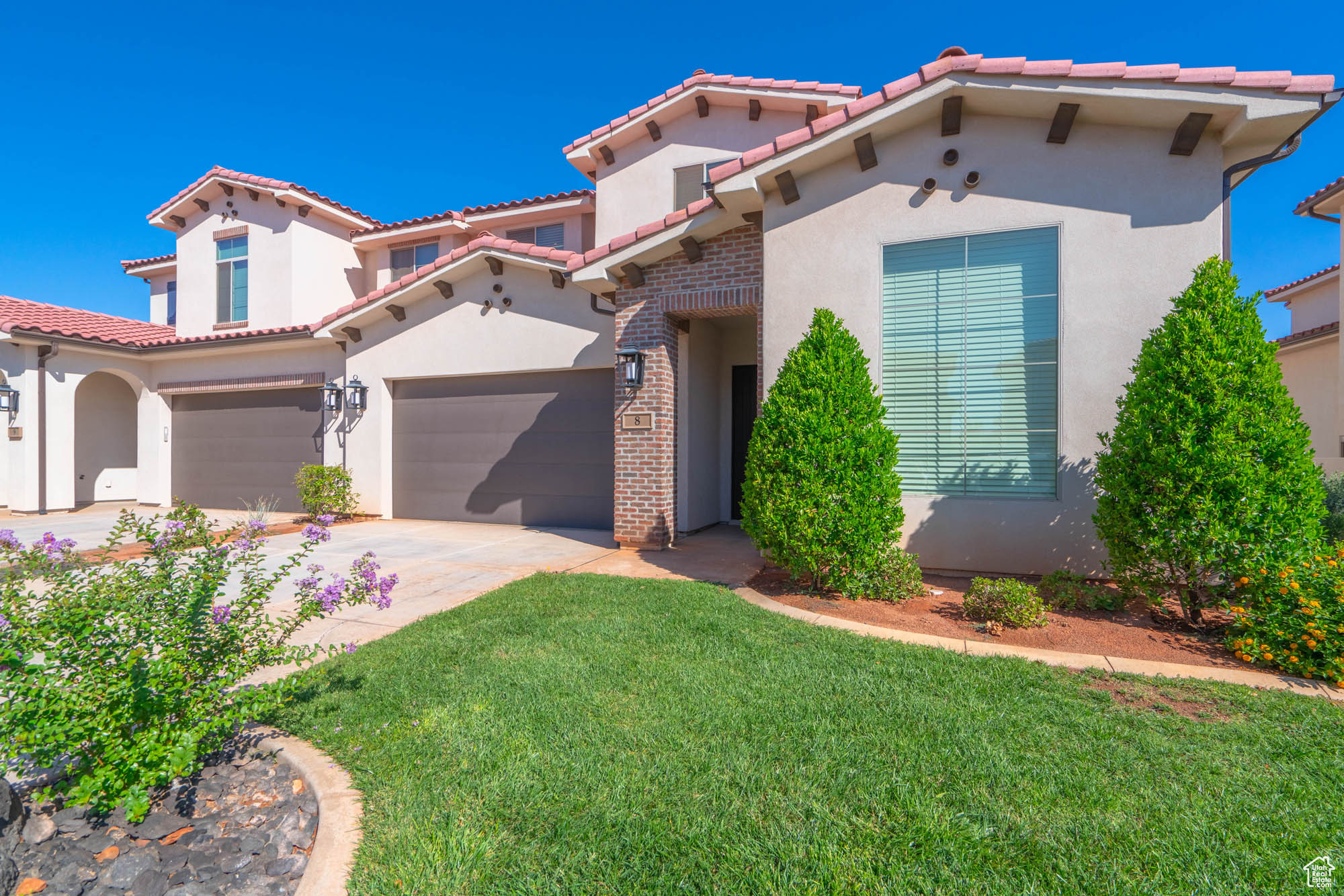 Mediterranean / spanish-style house featuring a front yard