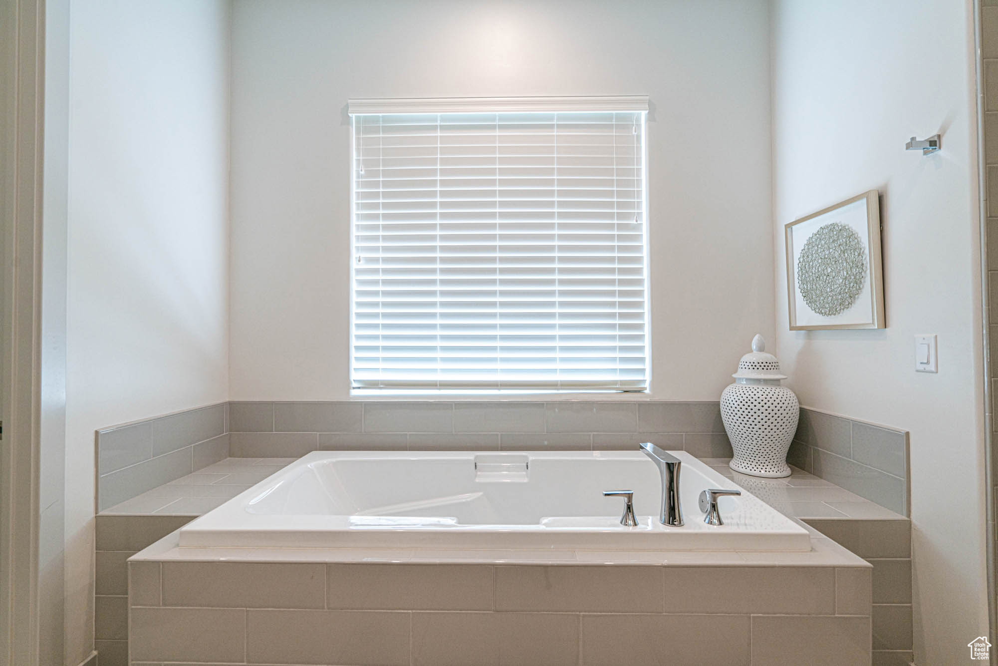 Bathroom with tiled tub