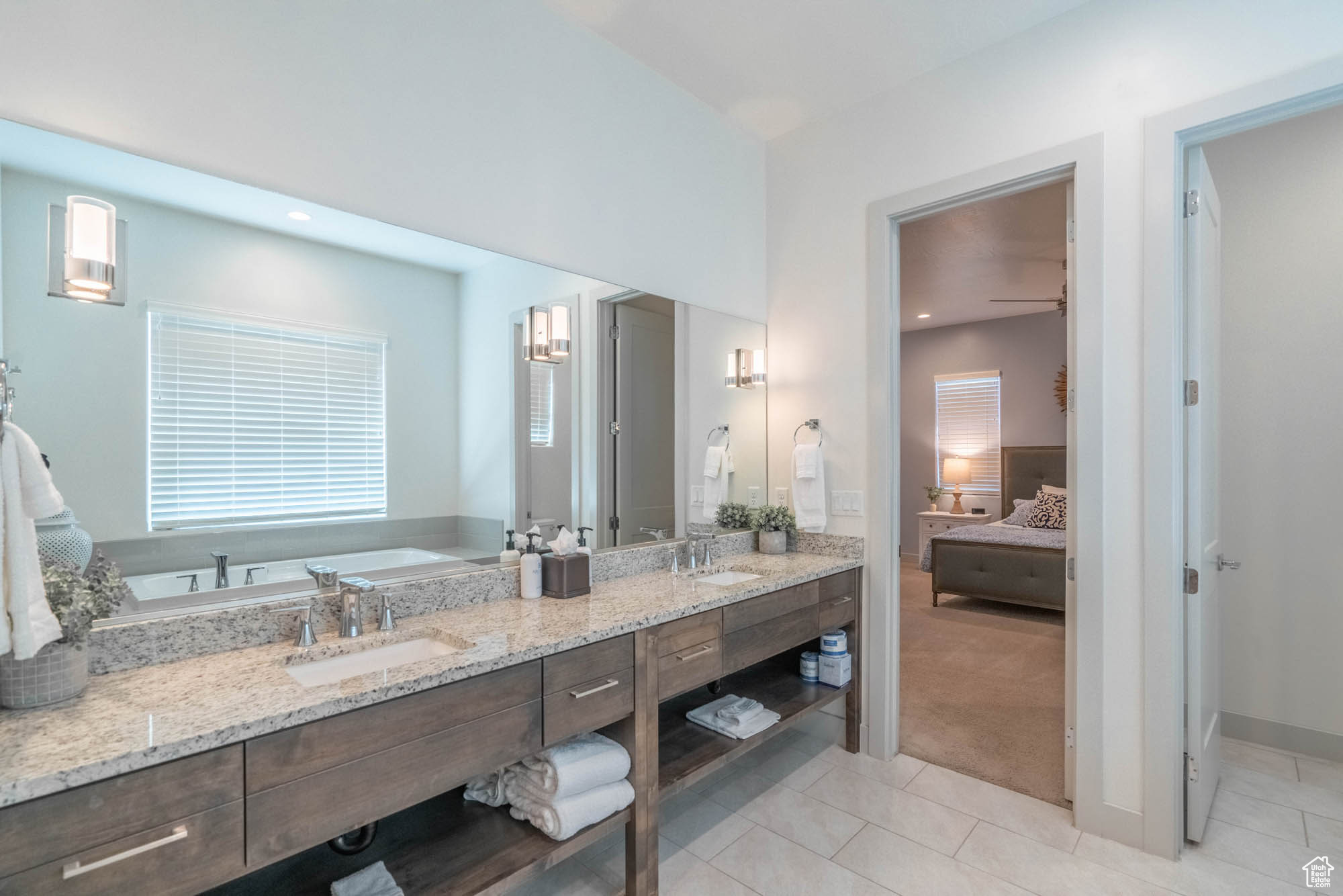 Bathroom with tile patterned flooring and vanity