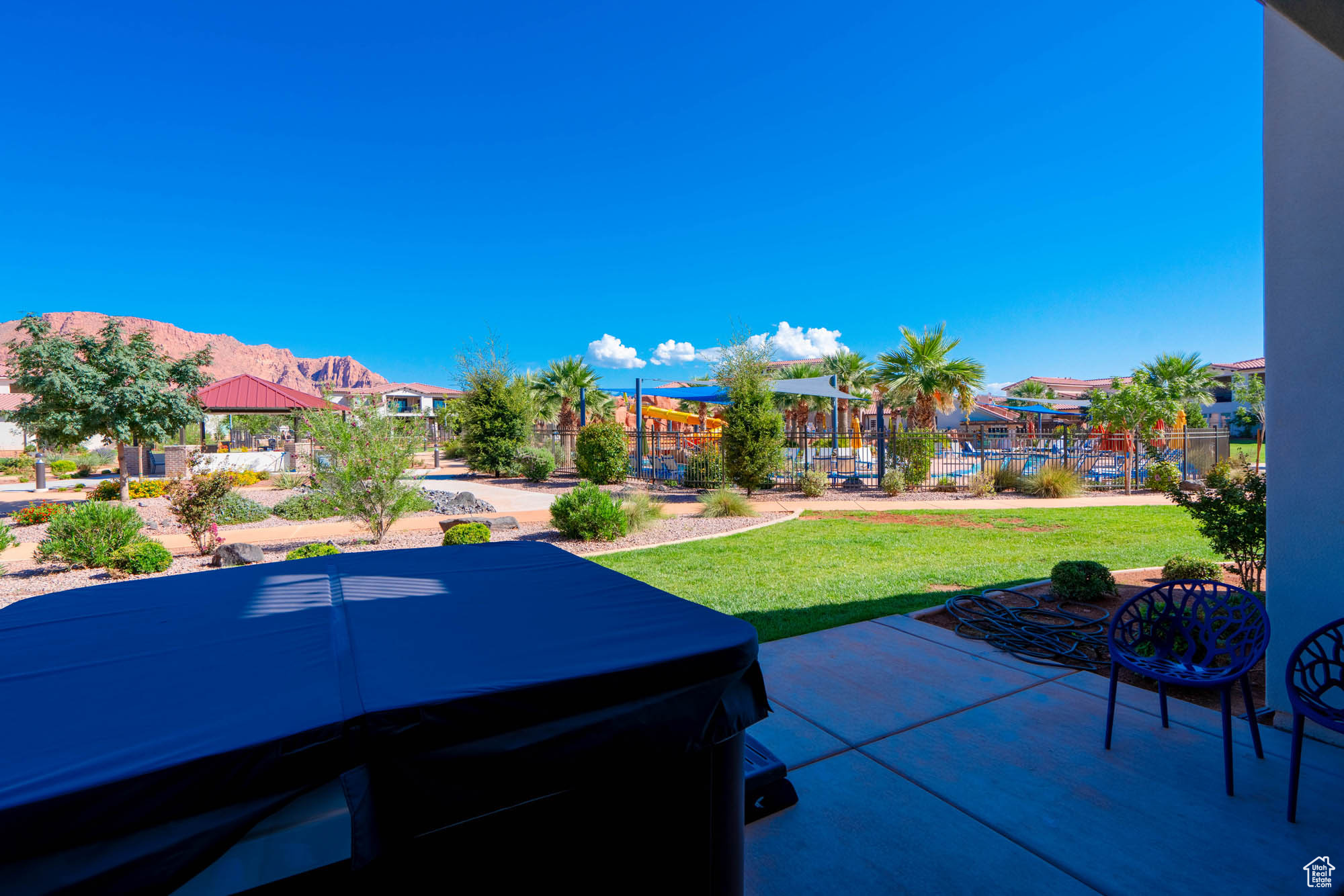 View of patio / terrace featuring a mountain view and a hot tub