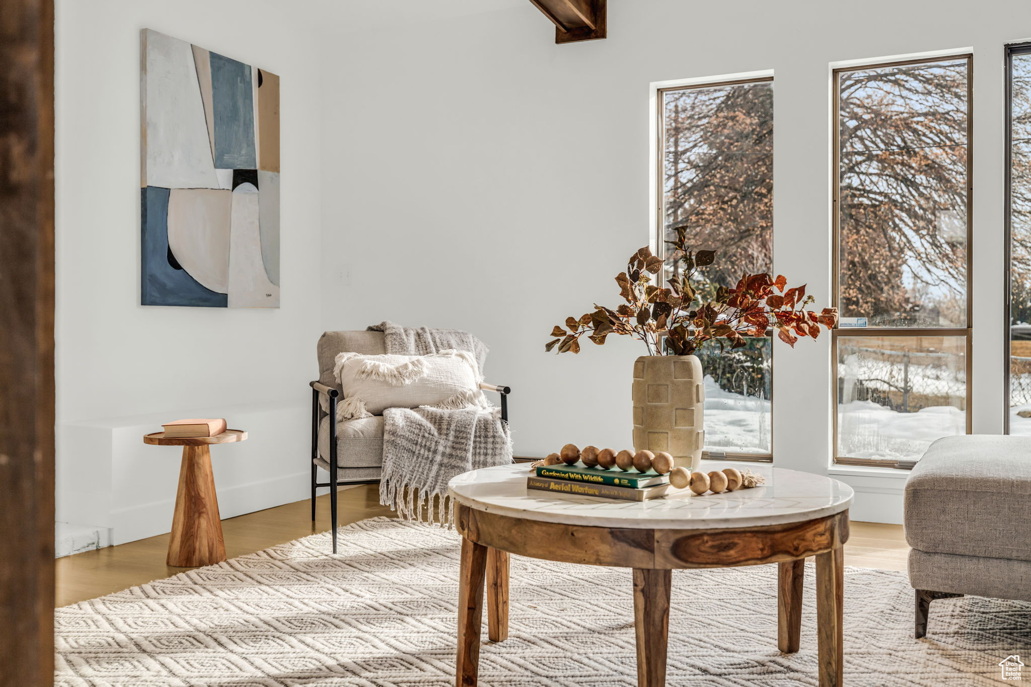 Living area featuring beam ceiling and hardwood / wood-style floors