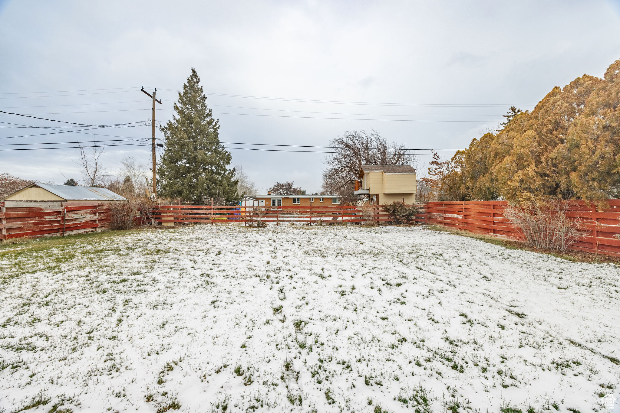 View of yard layered in snow