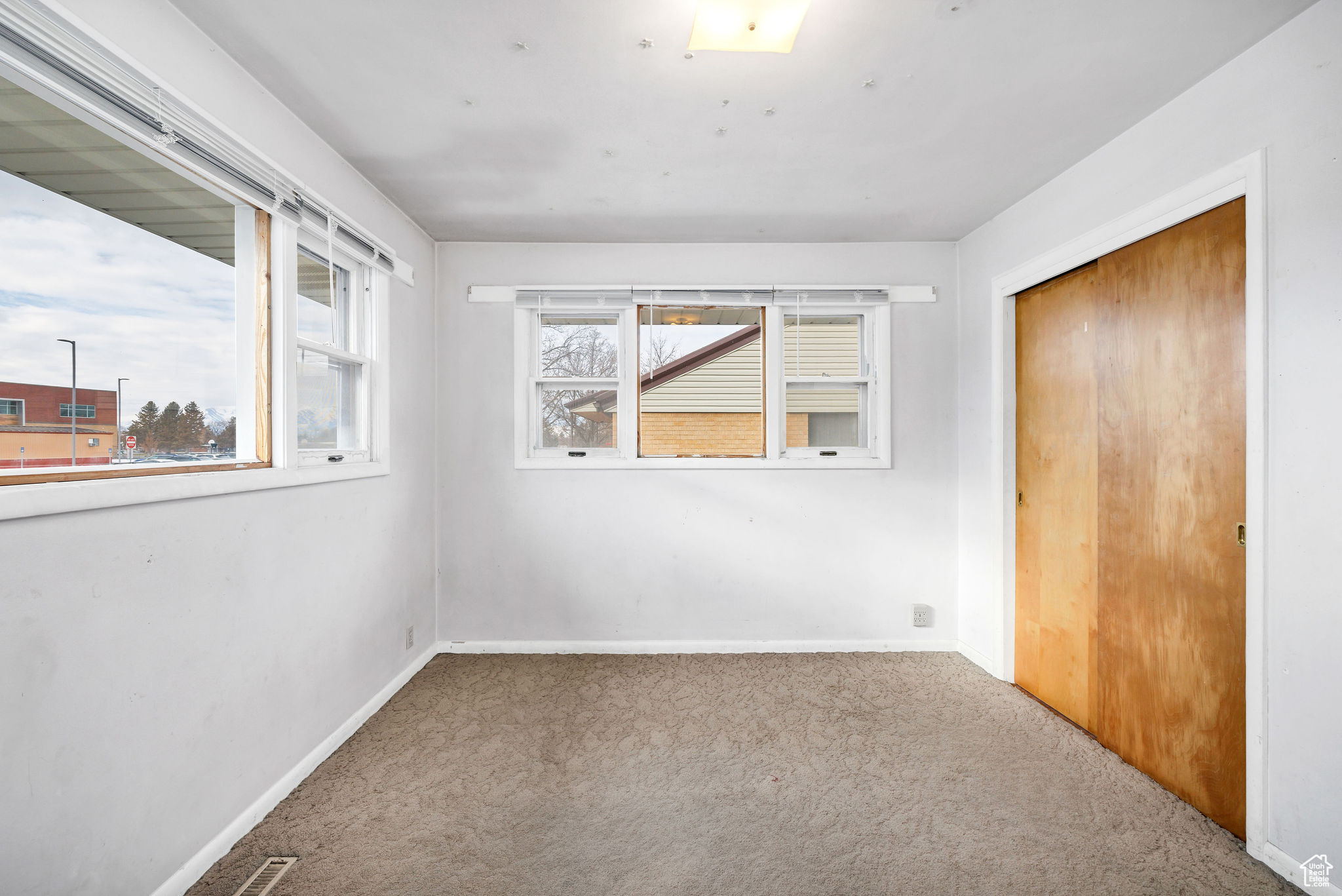 Unfurnished bedroom featuring carpet and a closet