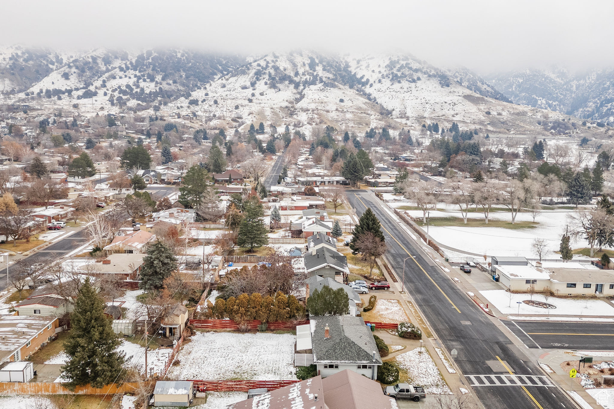 Snowy aerial view with a mountain view