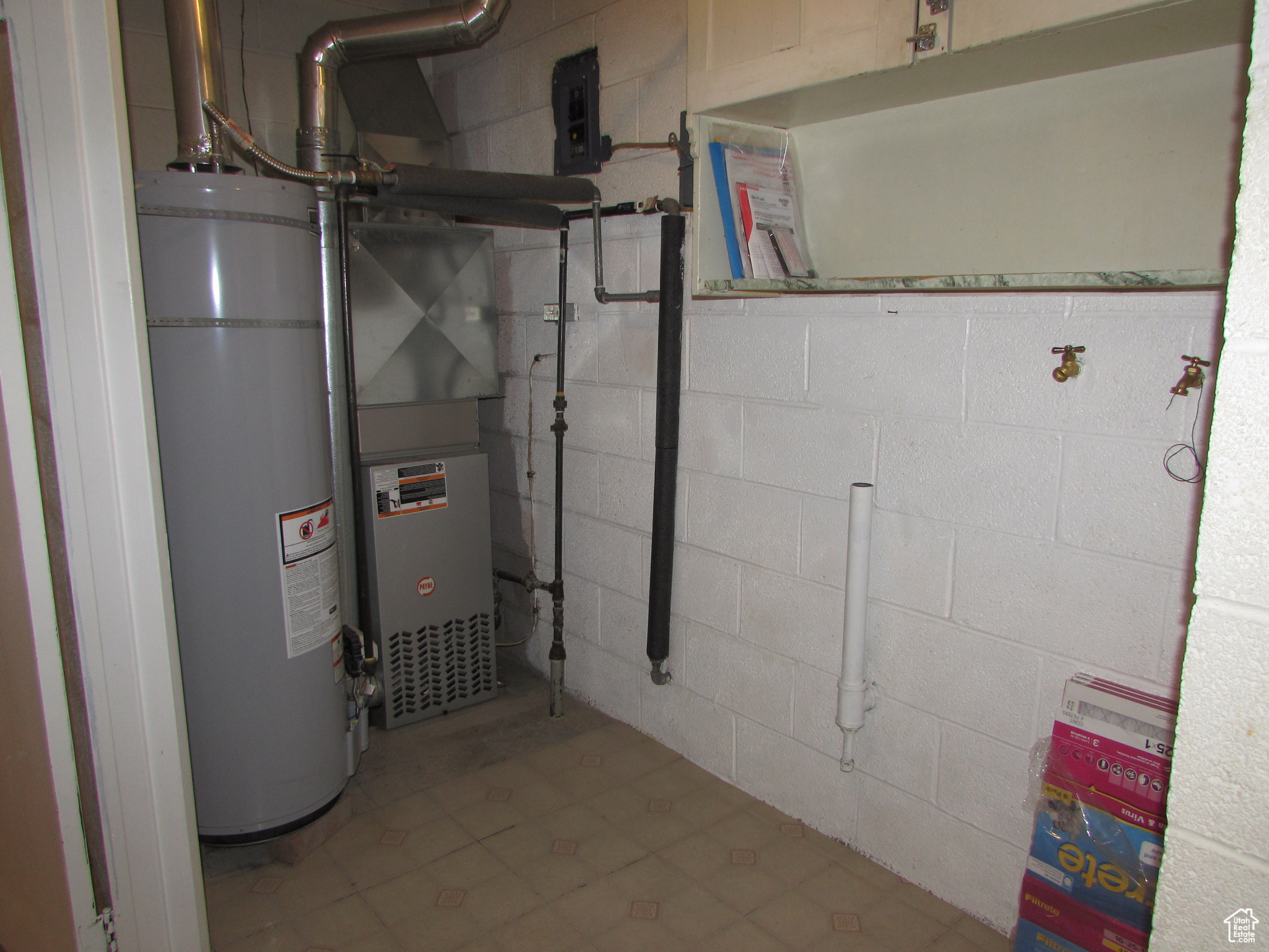 Apartment - Utilities with water heater and laundry area