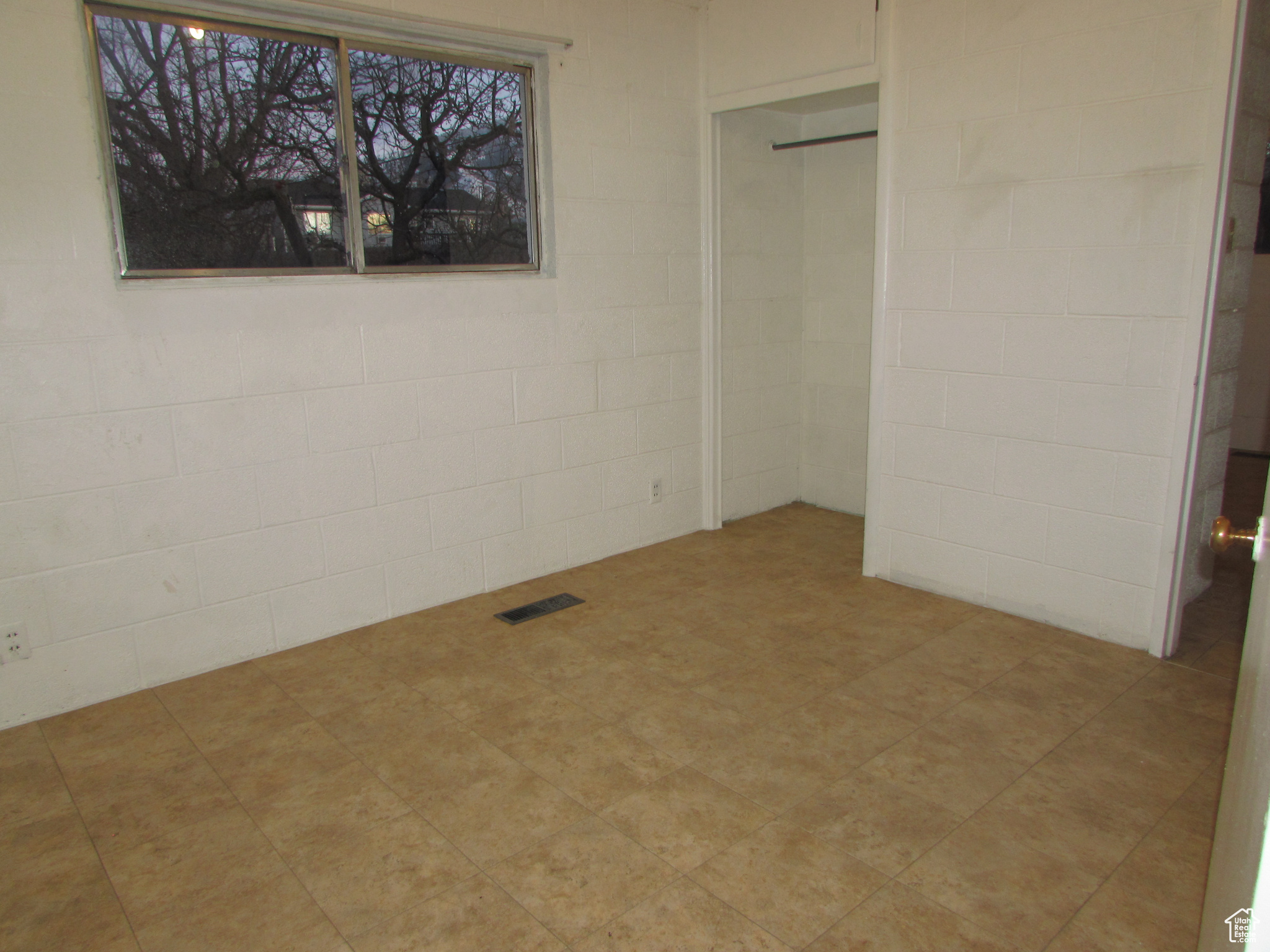 Apartment - bedroom #2 featuring tile floors and a closet