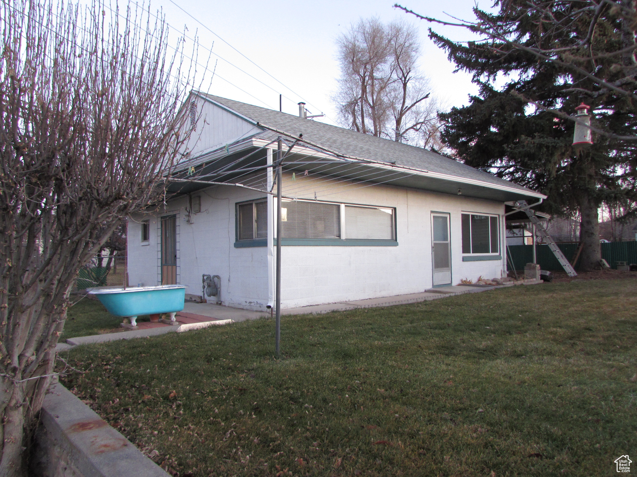 Apartment - View of side of property with a yard