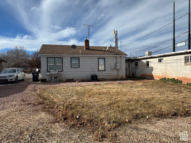 Back of property featuring central air condition unit