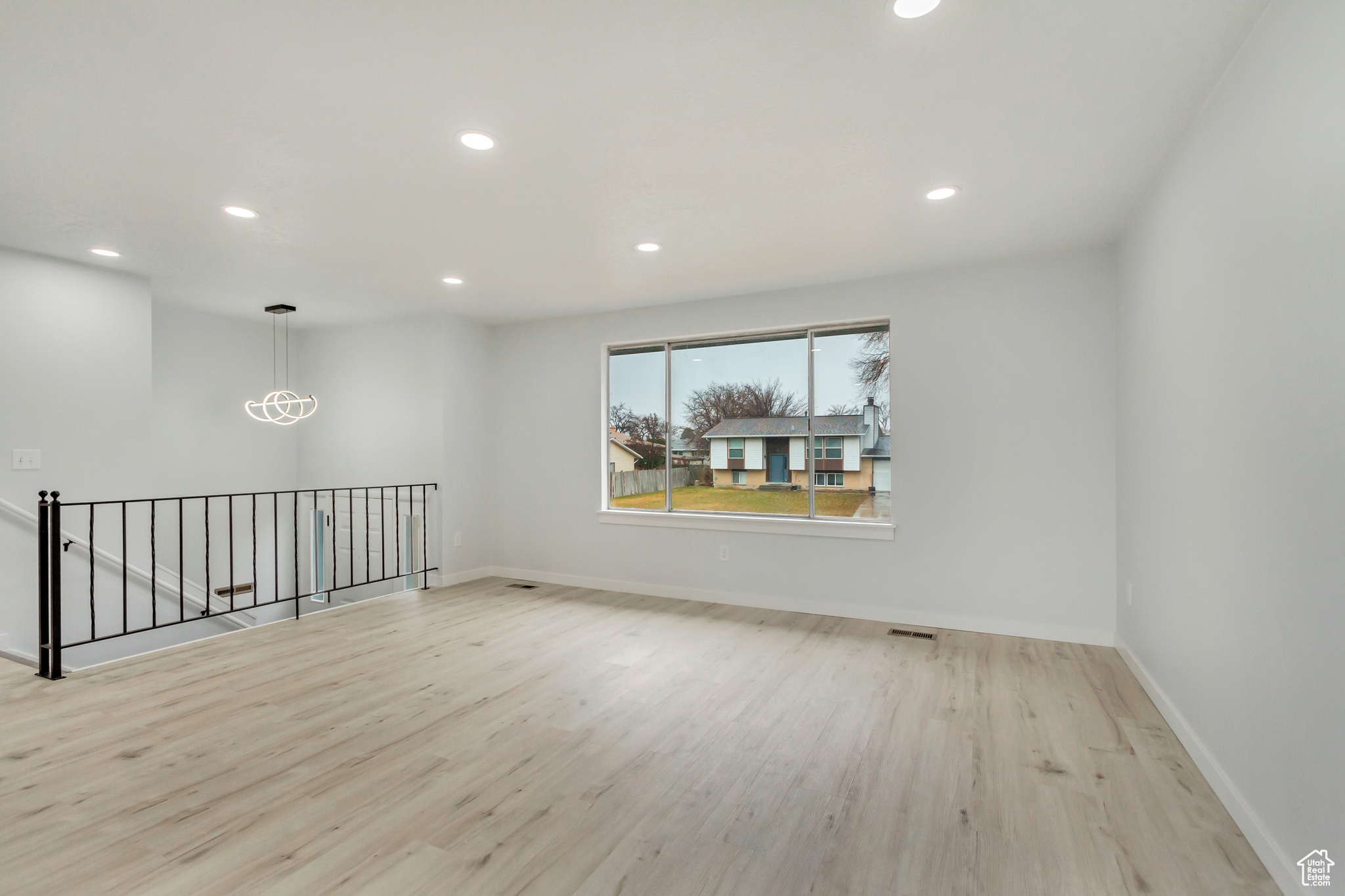 Empty room featuring light wood-type flooring