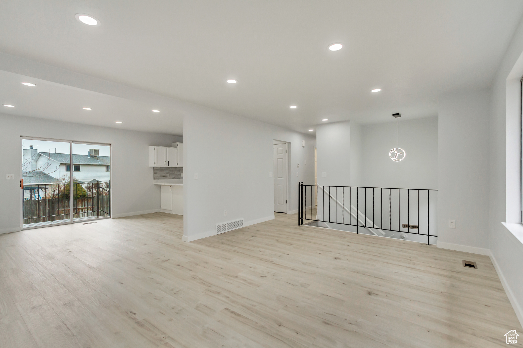 Unfurnished living room with light hardwood / wood-style flooring