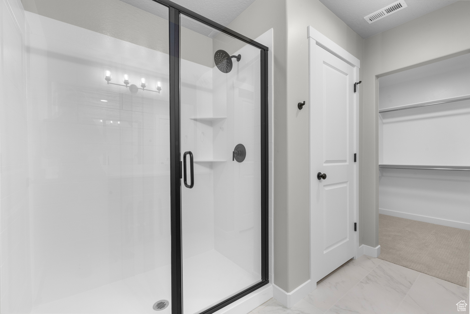 Bathroom featuring walk in shower