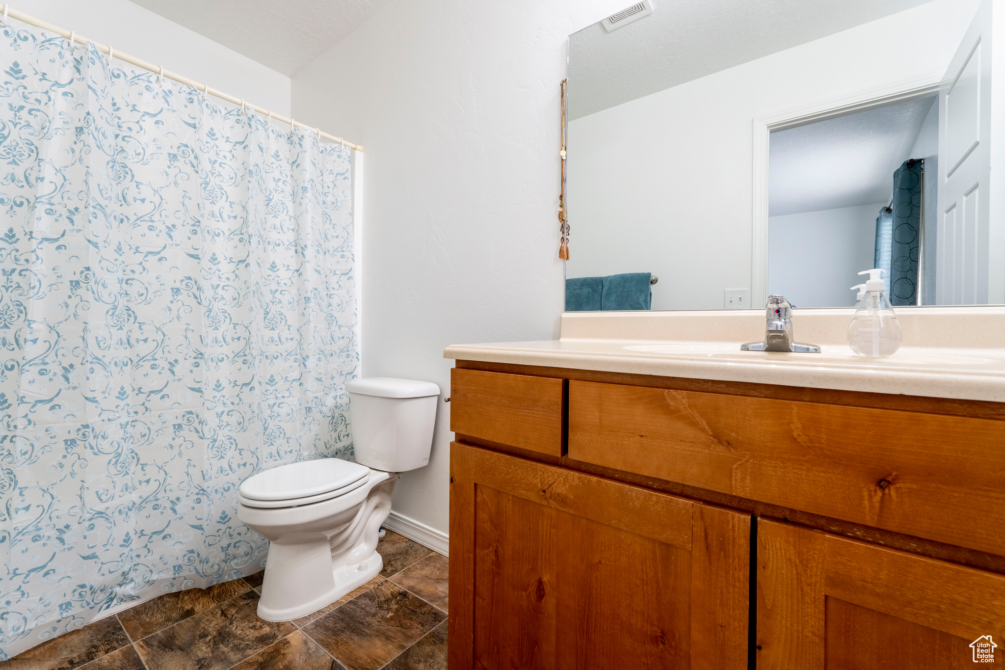 Bathroom with vanity and toilet