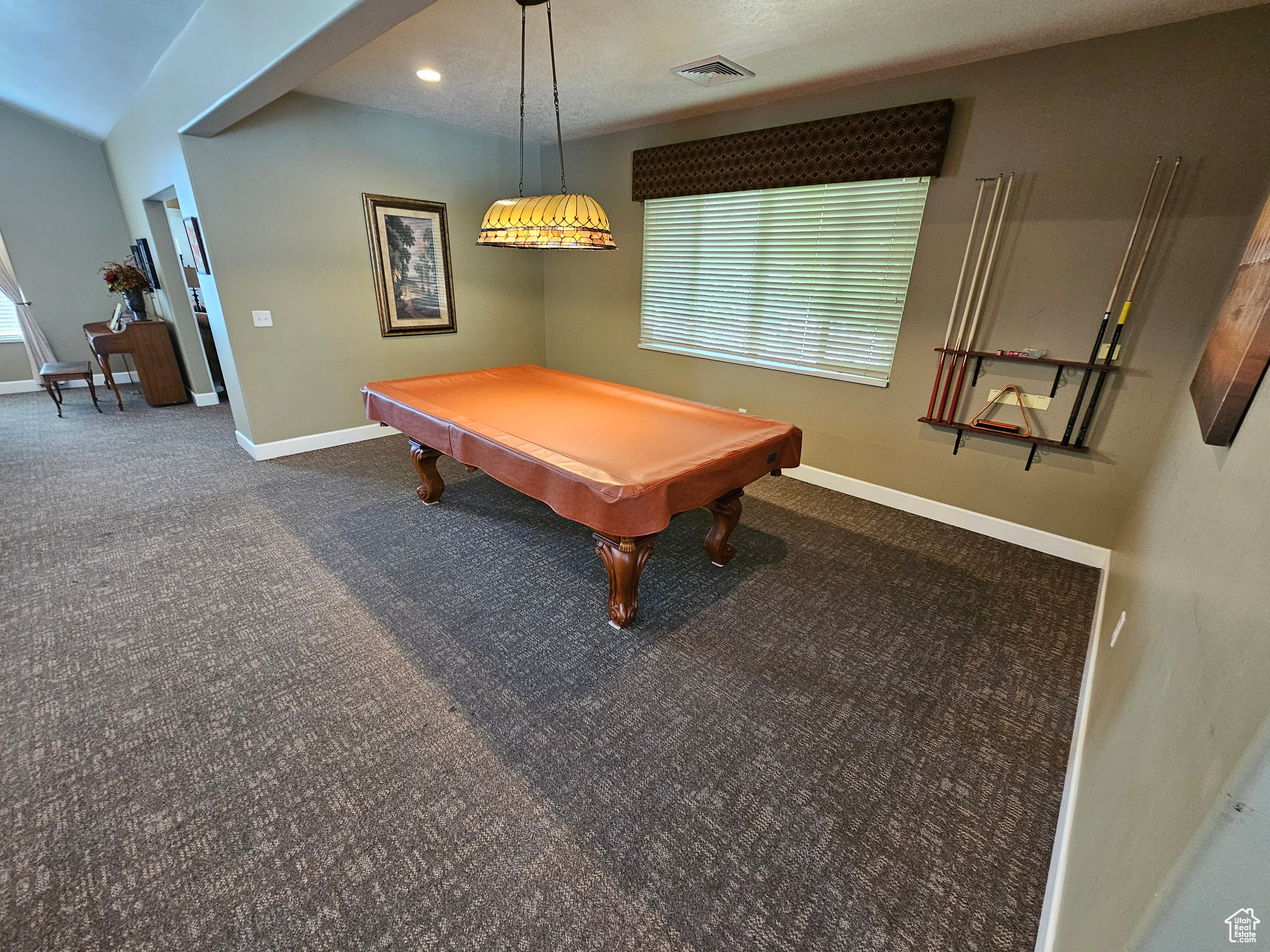 Rec room with dark colored carpet and pool table