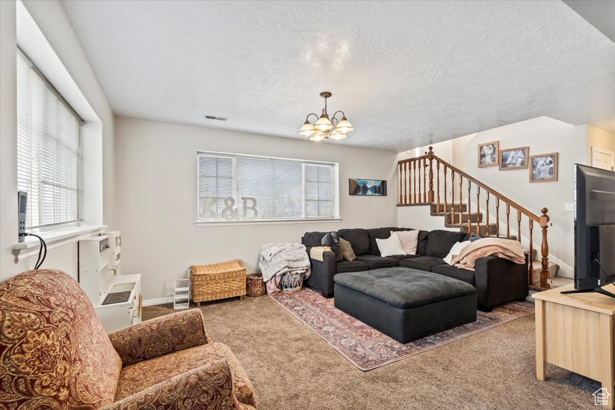 Cozy living room with a chandelier and carpet