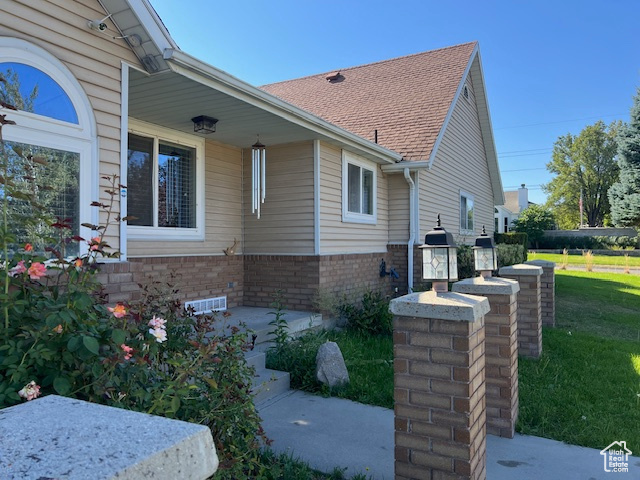 View of home's exterior with a lawn