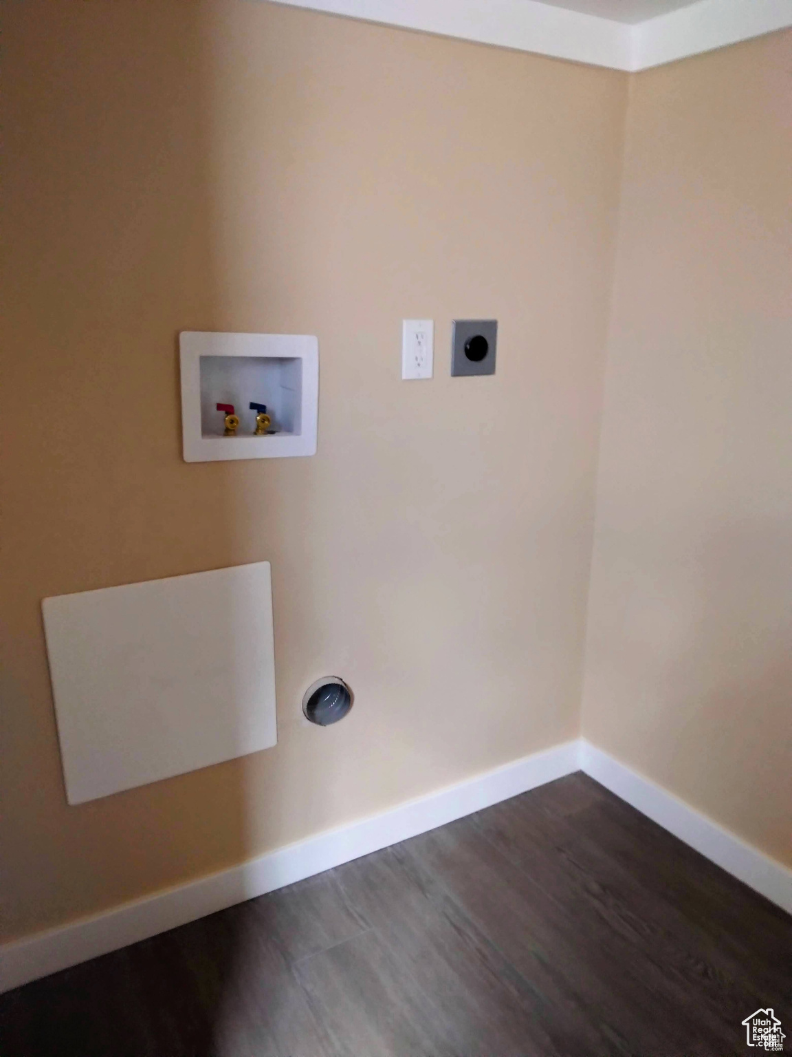 Laundry area featuring hookup for an electric dryer, hookup for a washing machine, and dark wood-type flooring