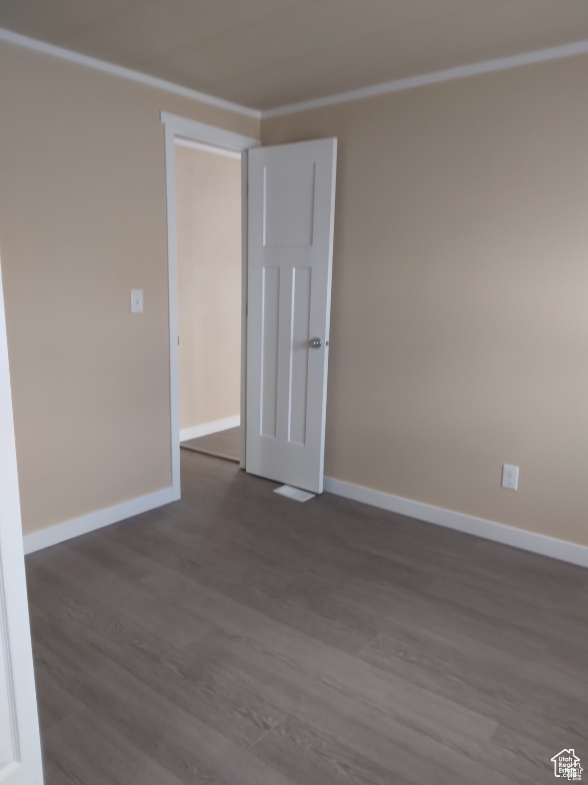 Unfurnished room with dark hardwood / wood-style flooring