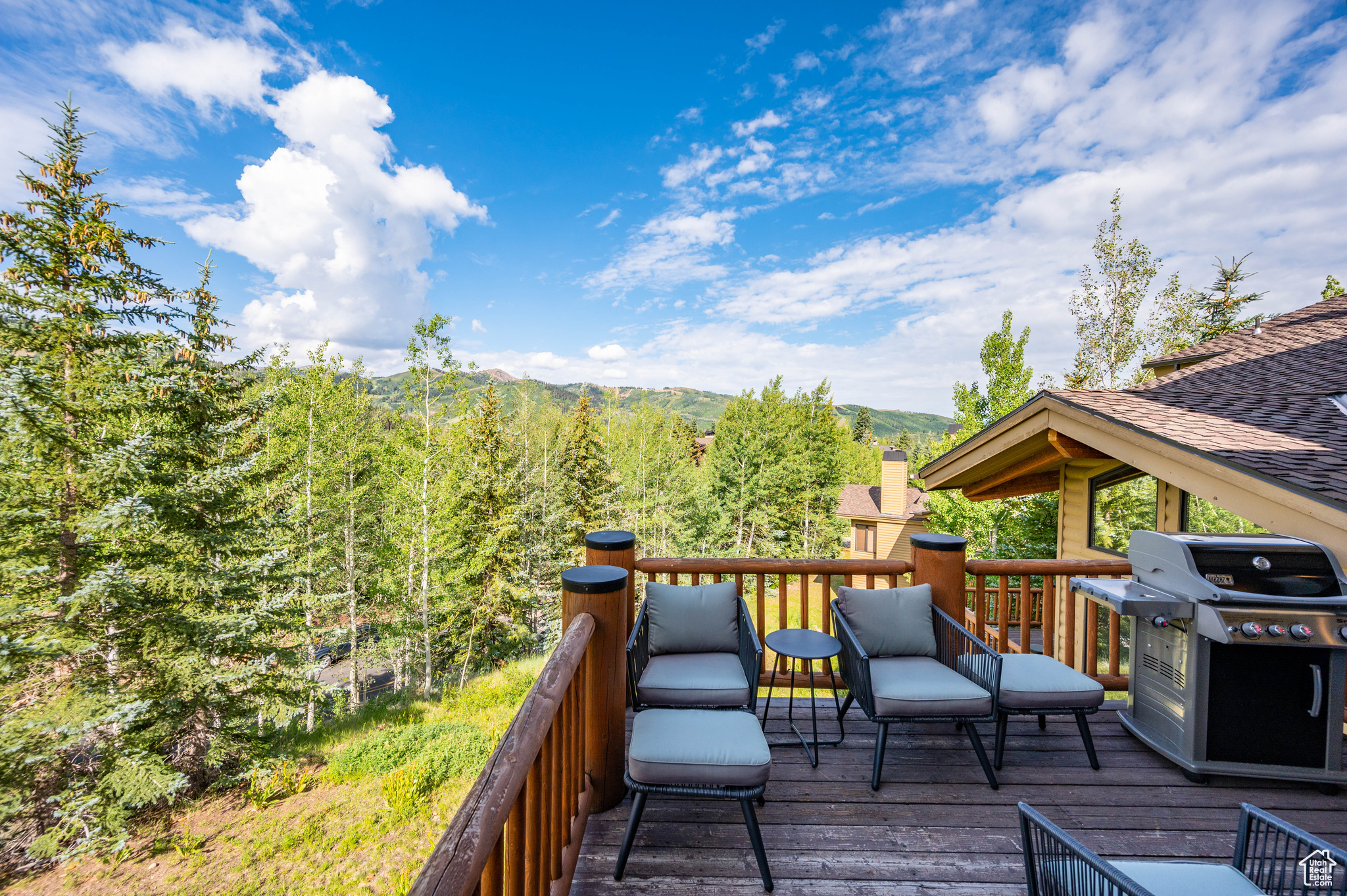 Wooden deck with grilling area and a mountain view