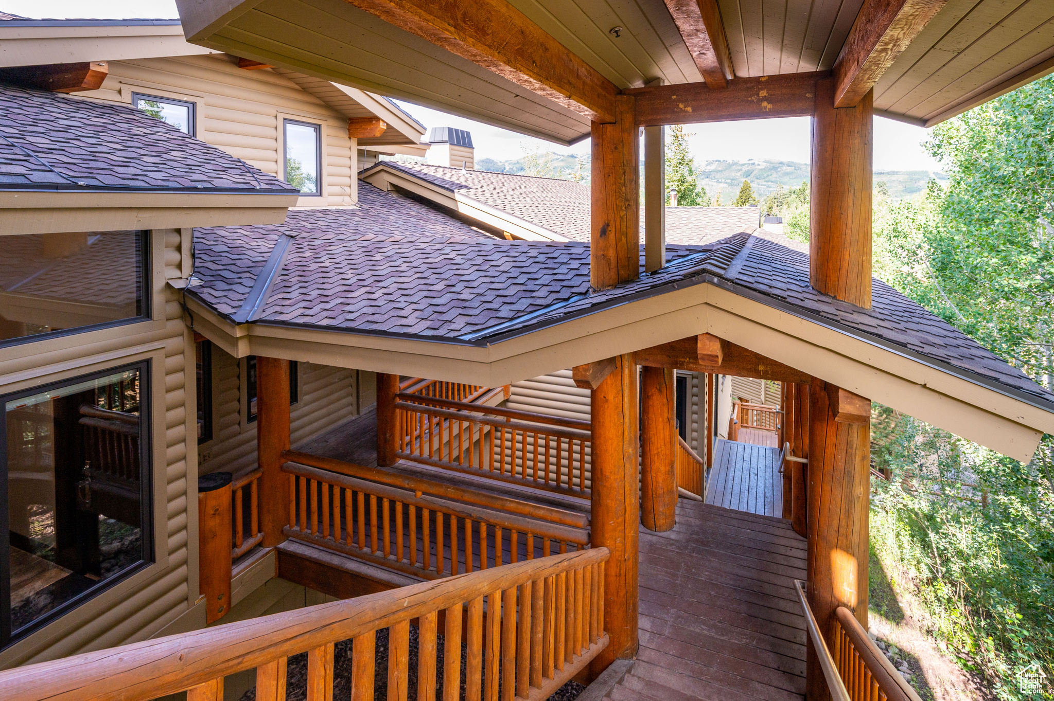 Wooden terrace featuring a mountain view