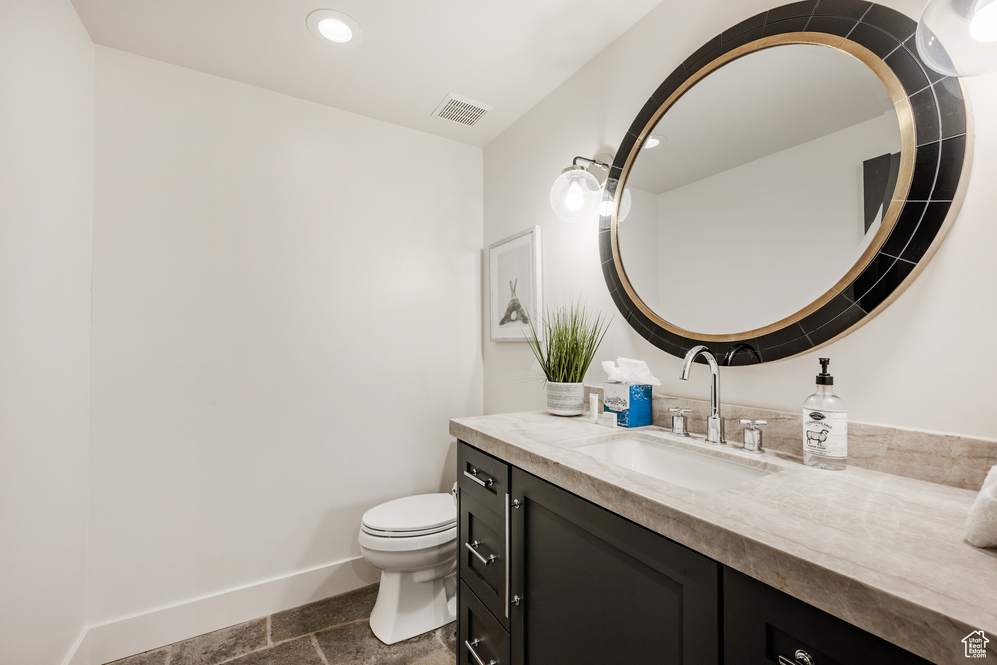 Bathroom with vanity and toilet