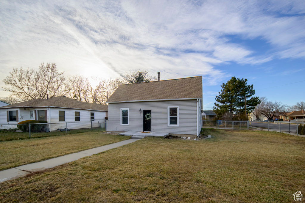 View of front of property with a front yard