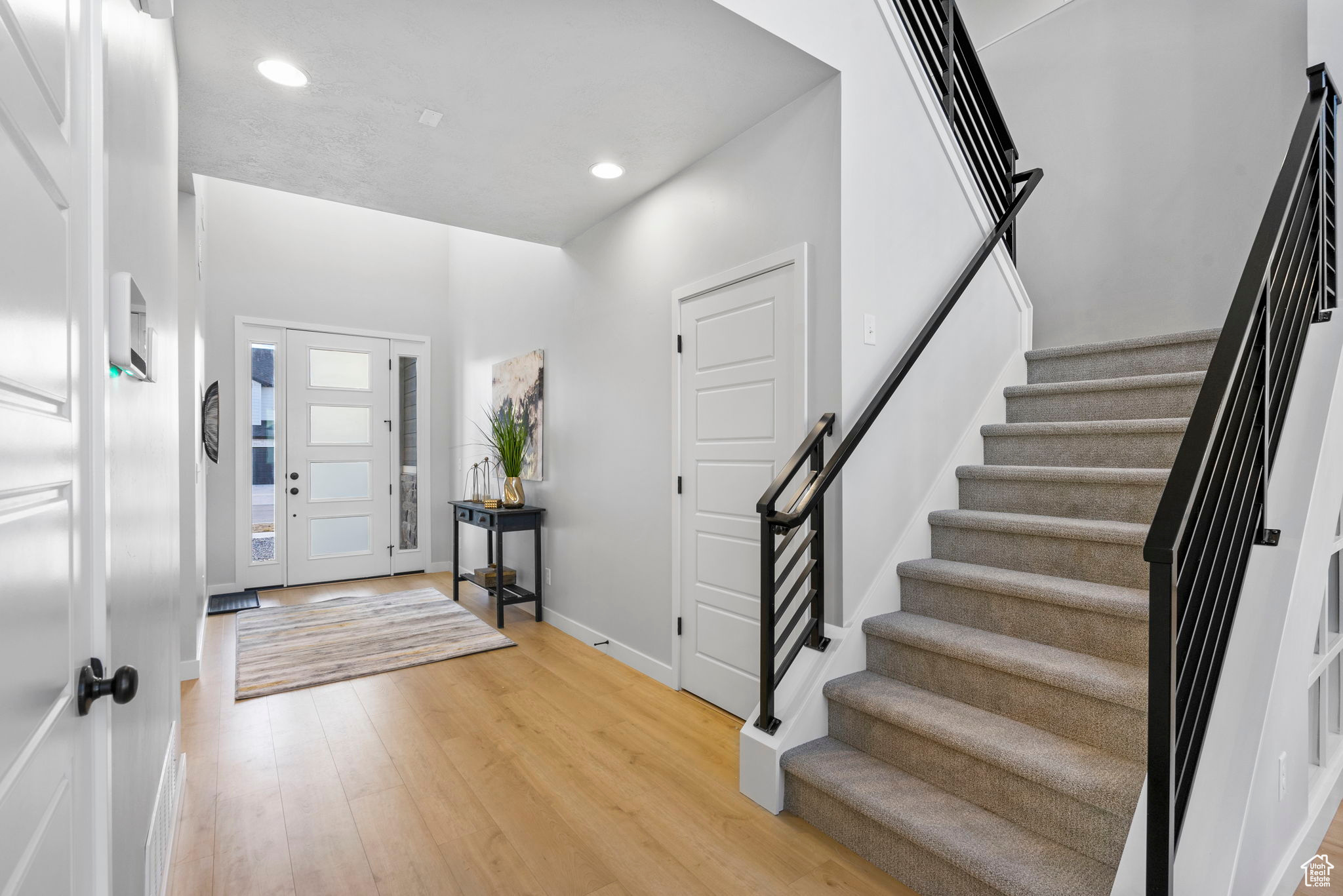 Entryway with light hardwood / wood-style floors