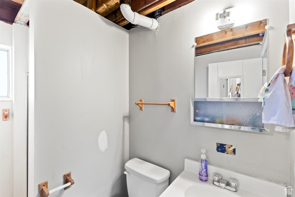 Basement 3/4 bathroom with toilet, shower  and sink