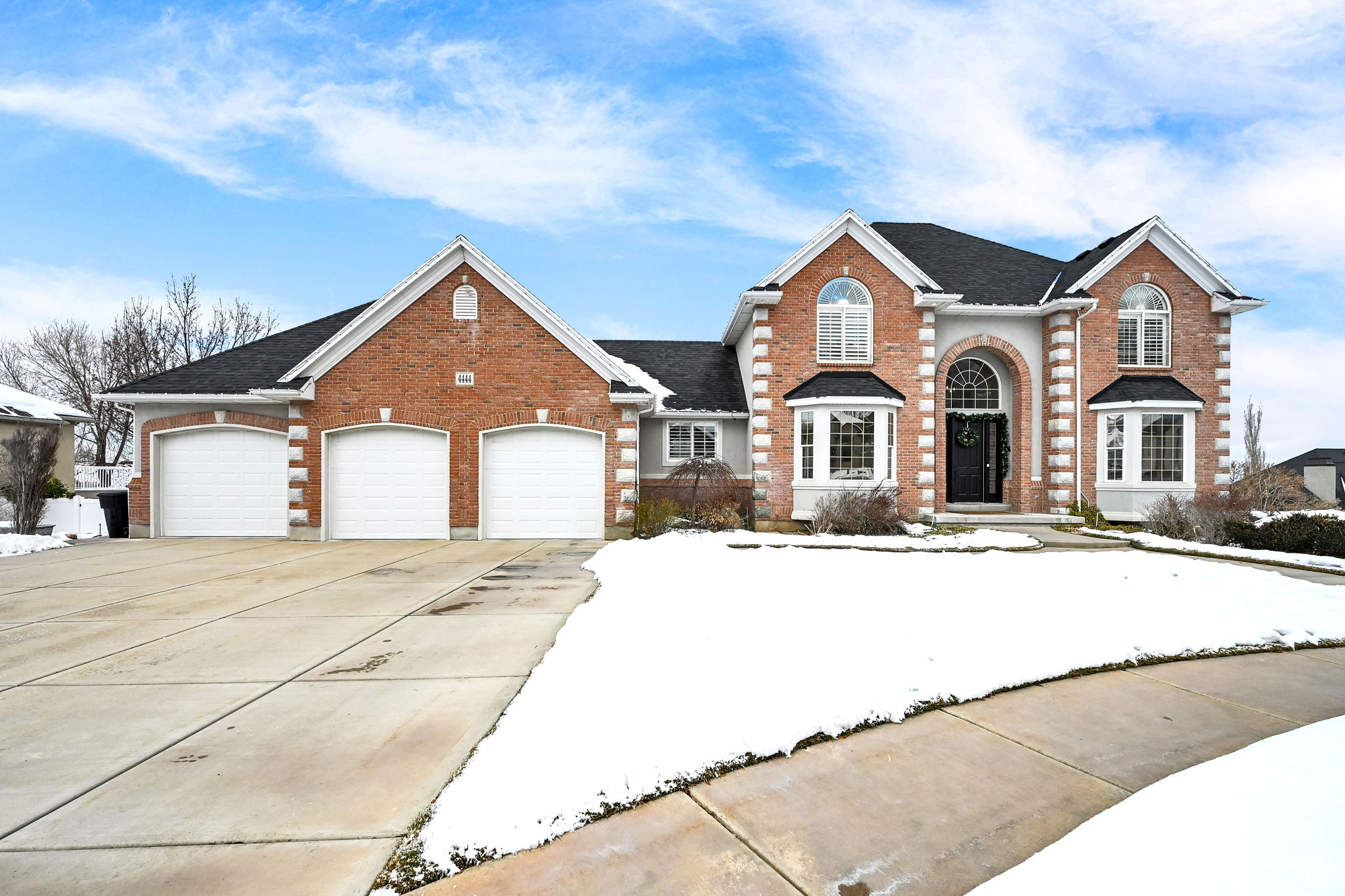 View of front facade featuring a garage