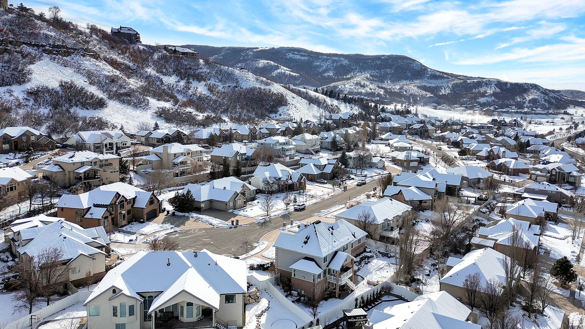 Snowy aerial view featuring a mountain view